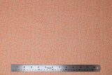 Flat swatch gemstone fabric (peach coloured fabric with tossed white gemstone shape outlines allover)