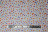 Flat swatch ice cream blossoms fabric (white fabric with tiny tossed colourful ice cream cones and sundaes with floral in tan, red, purple, blue, yellow colourway)