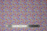 Flat swatch floral ice pop toss fabric (lavender fabric with tiny tossed decorative popsicles in yellow, red, purple, cream colourway with floral and patterned popsicles)