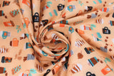 Swirled swatch Pumpkin Spice Latte fabric (pale orange fabric with fall/autumn pumpkin spice latte themed emblems allover in full colour: lattes, leaves, etc.)