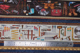 Flat swatch Blue Stripe fabric (brown and blue coloured horizontal stripes with illustrative style full colour tools within: ladder, drill, hammer, screw drivers, etc.)