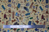 Flat swatch Tossed Tools Yellow fabric (pale yellow/natural coloured fabric with tossed illustrative style full colour tools: hammers, wrenches, paint brushes, tool boxes, etc.)