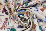 Swirled swatch Tossed Tools Yellow fabric (pale yellow/natural coloured fabric with tossed illustrative style full colour tools: hammers, wrenches, paint brushes, tool boxes, etc.)