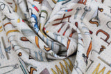 Swirled swatch Pegged Tools Natural fabric (illustrative style natural coloured peg board fabric with neatly organized full colour tools: wrenches, hammers, saws, etc.)