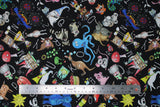 Flat swatch Alphabet Soup fabric (black fabric with tossed full colour cartoon/illustrative style zoo animals, floral, etc. with tossed white alphabet letters allover)