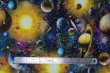 Flat swatch Artworks XVIII fabric (busy multi coloured galaxy printed fabric with tossed planets and stars all in bright colours)