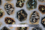 Flat swatch Vignette fabric (white fabric with tossed Vignettes in natural colours with realistic wolf graphics within, various styles)