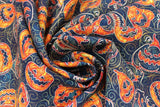 Swirled swatch Pumpkins fabric (black fabric with swirly designs in background and tossed jack o lantern pumpkins and outlines allover)