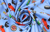 Swirled swatch Toss fabric (medium blue fabric with tossed cartoon style mechanic related emblems in full colour: car, tire, oil, tools, etc.)
