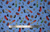 Flat swatch Toss fabric (medium blue fabric with tossed cartoon style mechanic related emblems in full colour: car, tire, oil, tools, etc.)