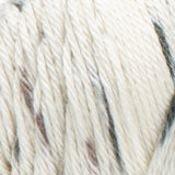 Swatch of Caron Simply Soft Speckle yarn in shade Seashell (white yarn with grey/brown speckles)