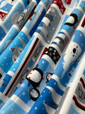 Swirled swatch winter themed flannel in Winter buddies (penguin, polar bear, fox and fish square labels on blue)