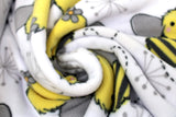 Swirled swatch FLC fleece print in Izzy Bee (happy cartoon bumble bees and grey plant shapes on white)