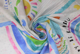 Swirled swatch learn to grow fabric (white and pale grey fabric with colourful stamp outline look patches in blue shades decorated with rainbows, coloured hearts, flowers and clouds with smiley faces, "Learn and Grow" text)