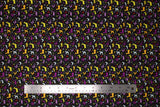Flat swatch spirit animals fabric (black fabric with tiny woodland creature silhouettes and abstract floral in yellow, cream, purple, red colourway)