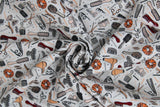 Swirled swatch Hair Tools fabric (white fabric with tossed illustrative full colour emblems allover related to hair: bobby pins, clips, scissors, combs, brushes, bows, flat irons, blow dryers, scrunchies, etc.)