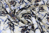 Swirled swatch fabric white layered poppies (white/black/yellow layered poppy heads allover)