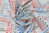 Swirled swatch white collage fabric (white fabric with collaged horizontal and vertical text allover in grey, black, red and blues. Canadian themed words and phrases "Canadian Capers" "Hockey Hero" "Cool" etc.)