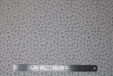 Flat swatch musical themed printed fabric in music notes (black notes on white)