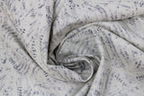 Swirled swatch musical themed printed fabric in sheet music (assorted scraps collage)