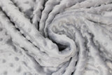 Swirled swatch light grey solid coloured minky fabric with embossed dots