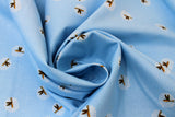 Swirled swatch Fireflies fabric (light blue fabric with tossed fireflies allover)