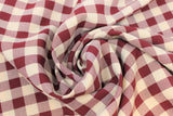 Swirled swatch maroon and white medium sized gingham print fabric