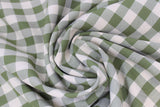 Swirled swatch green and white medium sized gingham print fabric