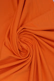 Swirled swatch Tricot Lycra solid fabric in orange