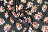 Swirled swatch of Nascar licensed fabrics in retro racing (black)
