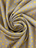 Swirled swatch microprint flannel in dainty flowers on brown (yellow tiny flower heads)