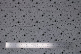 Flat swatch grey/black stars fabric (grey fabric with small and medium tossed black stars solid and outlines allover)