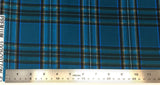 Flat swatch Stewart tartan printed fabric in green (deep green/blue fabric with black, white and blue plaid lines)