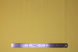 Flat swatch Cheer fabric (pale yellow orange fabric with subtle white O's circles allover)