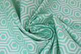 Swirled swatch blue fabric (light teal blue fabric with white geometric hexagon pattern allover)