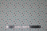 Flat swatch Multi Dot fabric (white fabric with medium amount of dots allover in light grey, dark grey and mint)