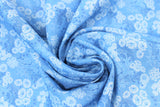 Swirled swatch Gabrielle fabric (medium blue fabric with blue swirly floral/greenery allover)