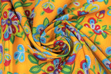 Swirled swatch Moosehide fabric (dark gold fabric with large tossed beaded/bubbled look drawn floral and greenery in white, yellow, red, purple, blue and green shades)