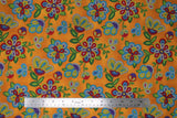 Flat swatch Moosehide fabric (dark gold fabric with large tossed beaded/bubbled look drawn floral and greenery in white, yellow, red, purple, blue and green shades)