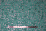 Flat swatch Blue Pinecones fabric (light teal blue fabric with marbled look, tossed pinecones allover in silver with metallic effect and dark teal)