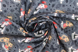 Swirled swatch Tattoo Girls fabric (dark grey fabric with cartoon pinup style tattoo girl heads/shoulders with "Love" and "Hope" banners, tossed black sketched traditional tattoo emblems)