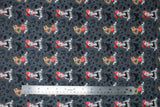 Flat swatch Tattoo Girls fabric (dark grey fabric with cartoon pinup style tattoo girl heads/shoulders with "Love" and "Hope" banners, tossed black sketched traditional tattoo emblems)