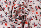 Swirled swatch Tattoos fabric (white fabric with tossed traditional style tattoo emblems allover in full colour/red toned style: peace signs, kisses, anchors, hearts, etc.)