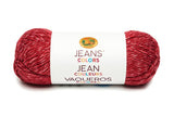 A ball of Lion Brand Jeans in colourway jumpsuit (deep cherry red with slight white marl)