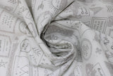 Swirled swatch take a hike ash fabric (white fabric with grey badges, text, and graphics allover related to hiking including "Roam" "Take a Hike" etc text, mountain and tree graphics, tipis, circular and rectangle badges with and without text)