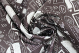 Swirled swatch take a hike soot fabric (black fabric with white and light grey badges, text, and graphics allover related to hiking including "Roam" "Take a Hike" etc text, mountain and tree graphics, tipis, circular and rectangle badges with and without text)