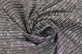 Swirled swatch nouns and verbs fabric (black fabric with small white writing lines completely underlined striped look of nouns and verbs and their definitions)