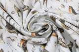 Swirled swatch Parchment Birds fabric (white fabric with tossed coloured illustrative design birds and labels)