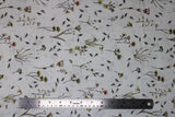 Flat swatch Parchment Floral fabric (white fabric with loosely tossed floral and stems with leaves and greenery in yellow, pink, blue shades)