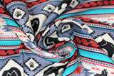 Swirled swatch Gray fabric (horizontal striped southwest style fabric with geometric shapes and bear silhouettes/paws allover in grey, black, red and teal shades)